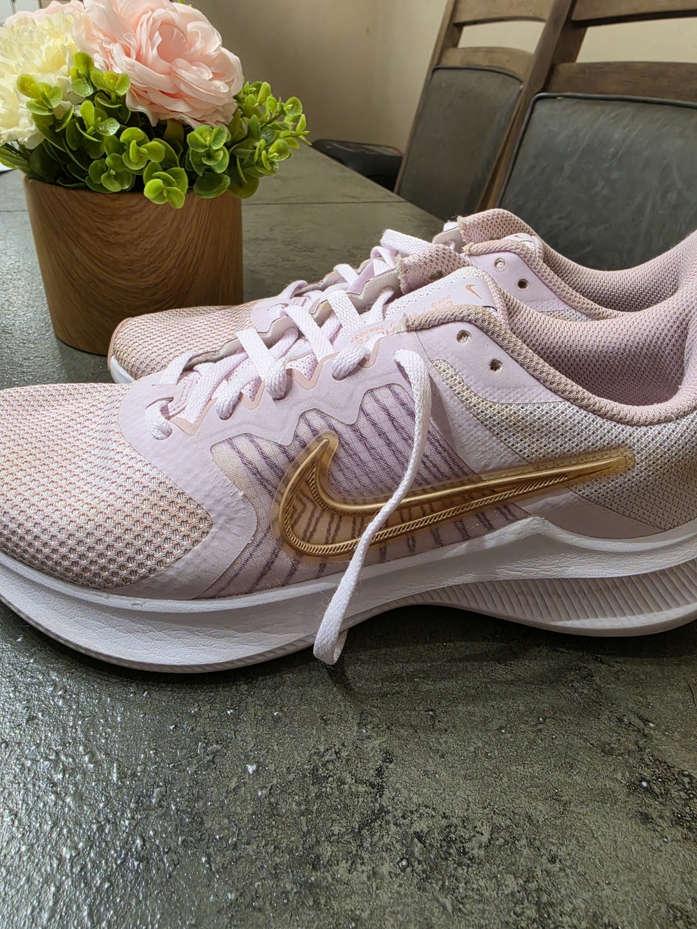 Nike Women’s Light Pink Running Shoes with Gold Swoosh